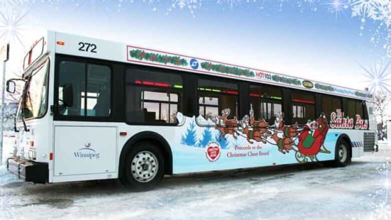 The side of a bus has an image of Santa in his sleigh and it says 