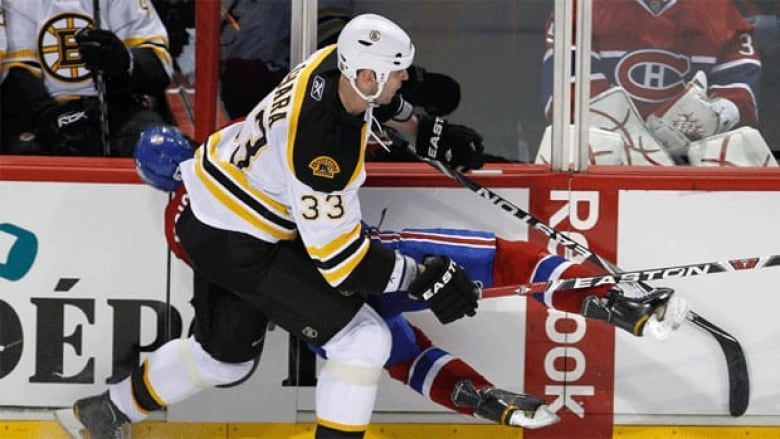 Boston Bruins defenceman Zdeno Chara hits Montreal Canadiens player Max Pacioretty into a metal stanchion.