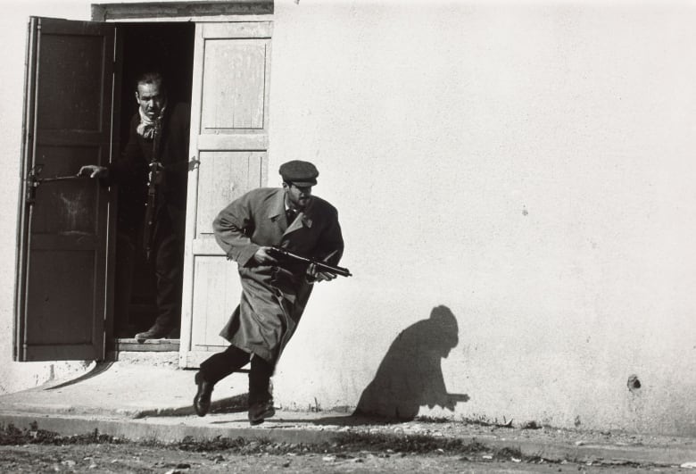 A Turkish fighter leaves the side entrance of a cinema in Limassol, Cyprus in 1964.