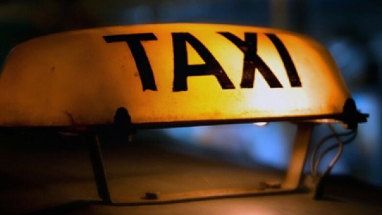 A yellow taxi sign.