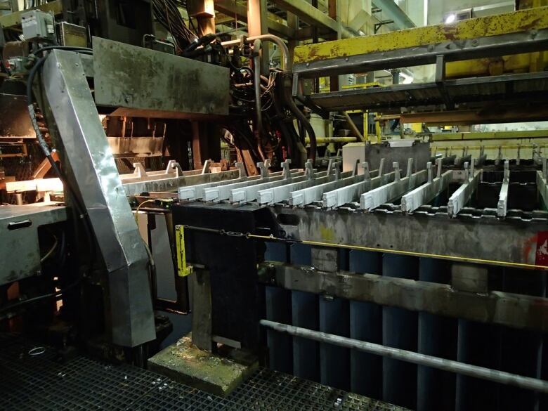 Metal machinery is seen inside a zinc mine.