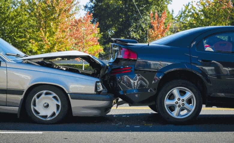 Minor accident with one car rear-ending another.