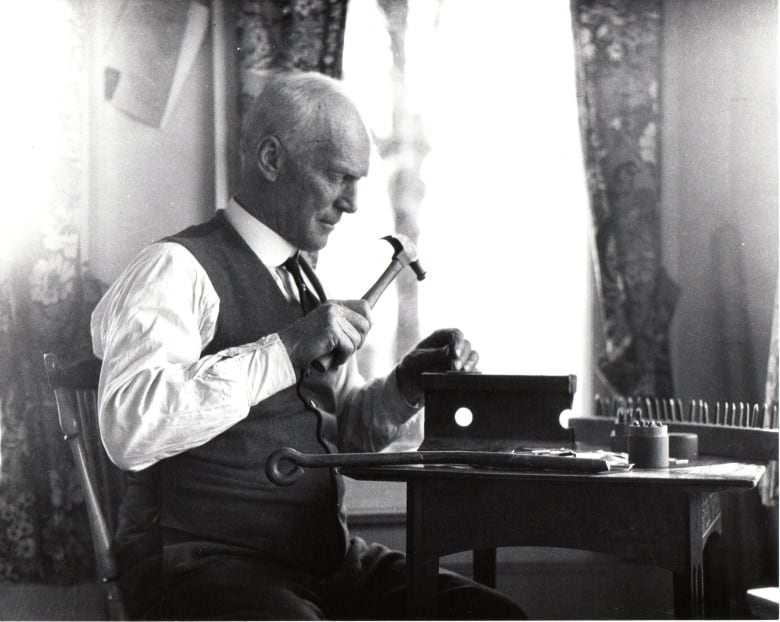 Jack Miner stamping bands at his home.