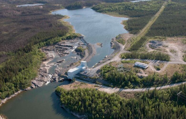 Aerial view of a hydroelectric dam and water reservoir.