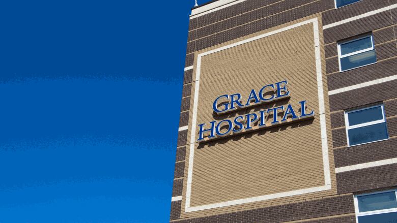 Side of a brick building with the words Grace Hospital