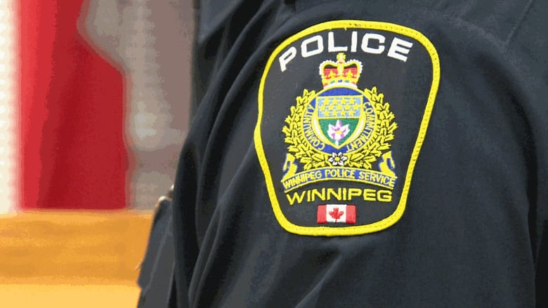 A police patch on the arm of a member of the Winnipeg Police Service.