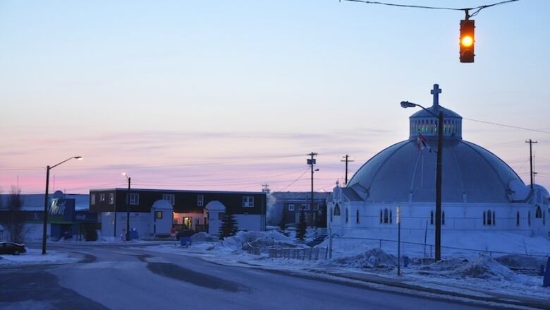 A northern town in winter at twilight.