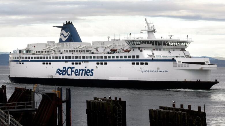 A large ferry ship in the water.