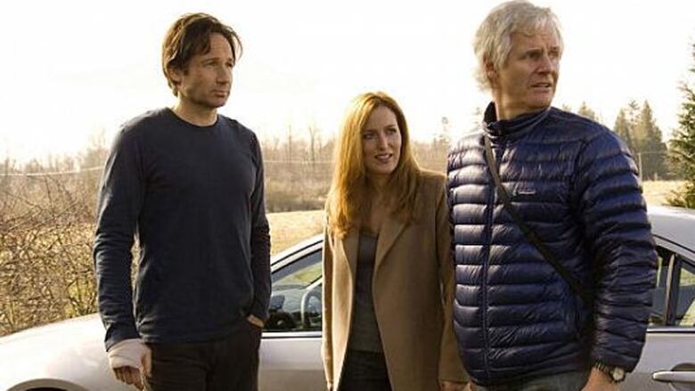 David Duchovny, left, Gillian Anderson, and director Chris Carter stand together during the filming of The X-Files: I Want to Believe, which was shot in British Columbia.