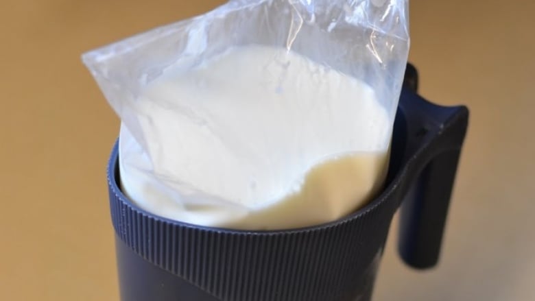 A milk bag in a plastic pitcher