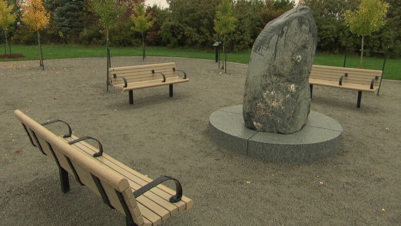 This inscribed monolith is at the centre of a memorial park. It is surrounded by six unique sections  one in honour of each person who died in the bus-train crash.