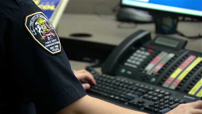 Arm of an EMS Fire Police officer is typing on a keyboard.