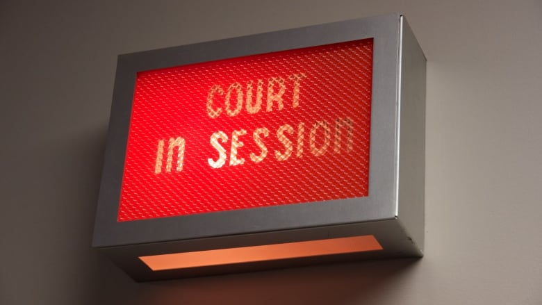 A red 'Court in session' sign is shown.