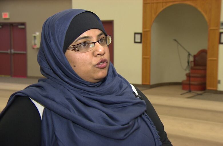 A woman in a hijab is seen in a profile photo