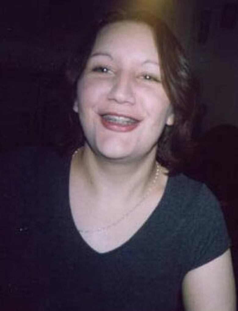 A young woman with braces.