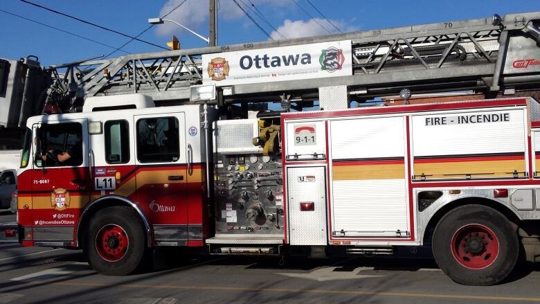 A fire truck, seen from one side.