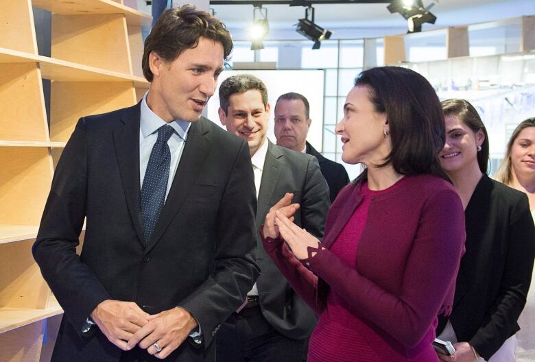 Prime Minister Justin Trudeau chats with Sheryl Sandberg, Facebook chief operating officer during a bilateral meeting in Davos, Switzerland on Wednesday, Jan. 20, 2016. Trudeau is attending the the World Economic Forum where political, business and social leaders gather to discuss world agendas. 