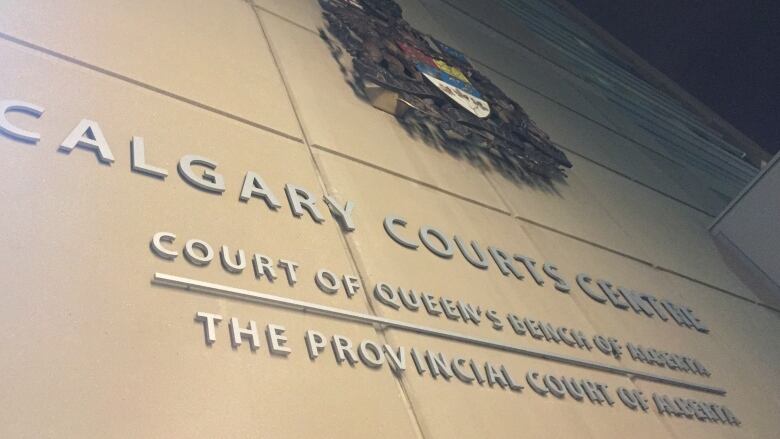 A photo of the sign at court's centre in Calgary.