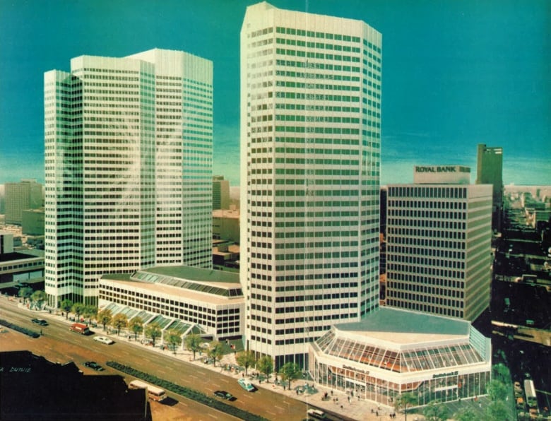 A drawing shows white buildings, which are models for a proposed development.