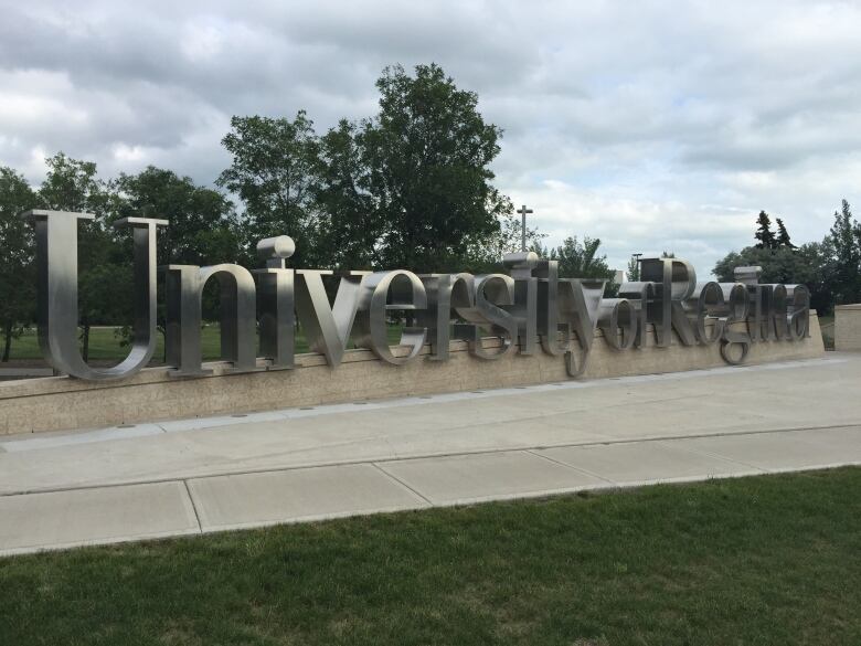 A large sign with the words University of Regina. 