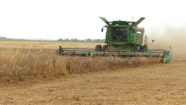 A farm machine works through a field.