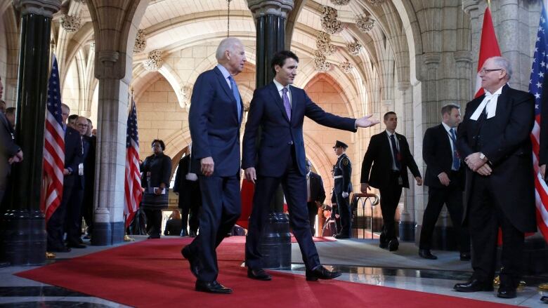 Two men tour Parliament Hill.