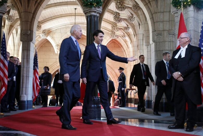 Two men tour Parliament Hill.