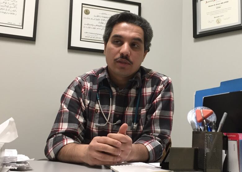 Dr. Ghassan Al-Naami, photographed at his desk in early 2017 while working in Fort McMurray, Alta. 