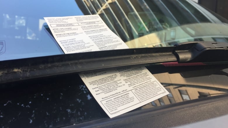 Ticket under a windshield wiper