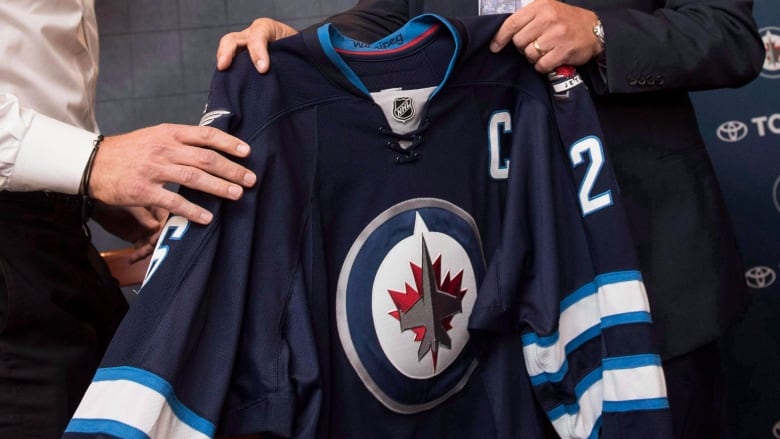 A Winnipeg Jets jersey is pictured.