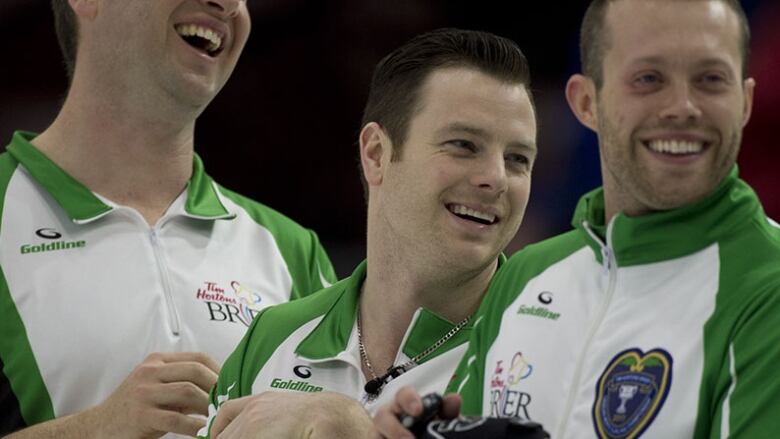 Curling teammates smiling