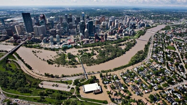 The Bow River swells surrounding Prince's Island Park, centre, after the June 2013 flood that devastated some southern Alberta communities, costing up to $6-billion in property damage and financial losses.