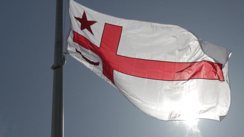 A white flag with red symbols is shown with the sun in the background.