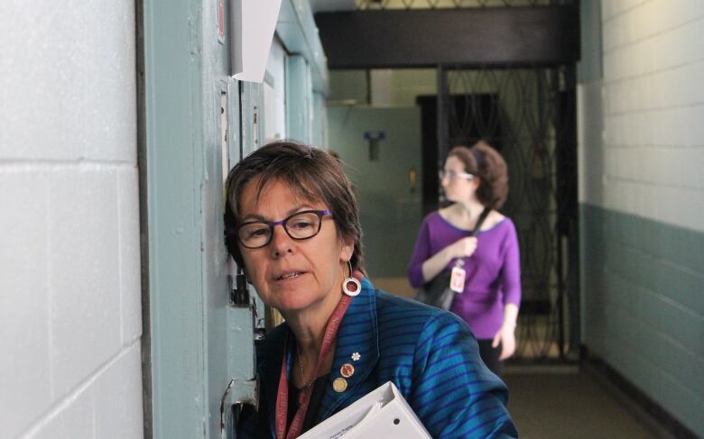 Senator Kim Pate listens to an inmate being held in segregation during a visit to Ontario's Millhaven Institute on May 16, 2017.