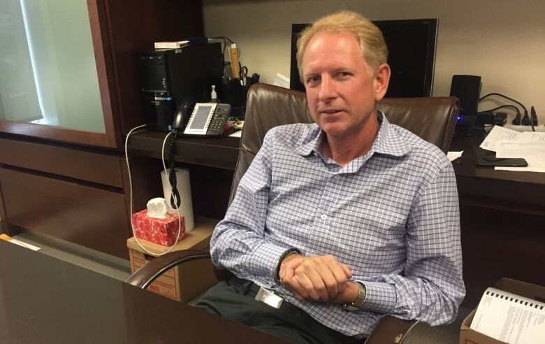 A man sitting in an office.