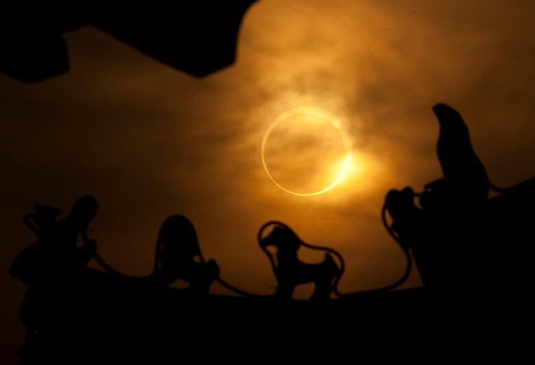 The sun is partially blocked by the moon during a solar eclipse.