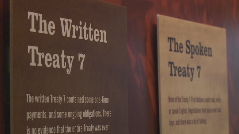 Two placards display the Treaty 7 agreement. 