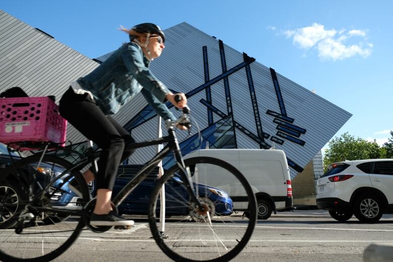 A cyclist rides in a bike lane.