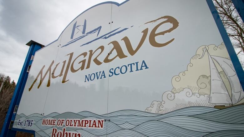 A white sign reading Mulgrave, Nova Scotia seen from below