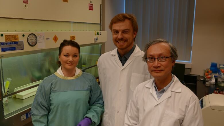 Dr. Guillaume Poliquin, centre, is the new acting scientific director general of the National Microbiology Lab in Winnipeg.  