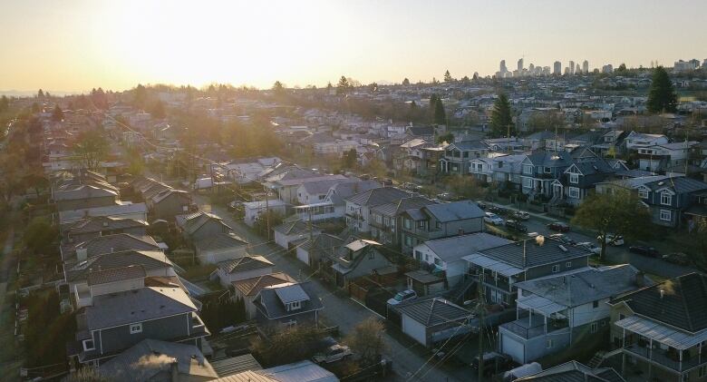 Rows of single-family homes in East Vancouver, with downtown Vancouver in the top right of the image.