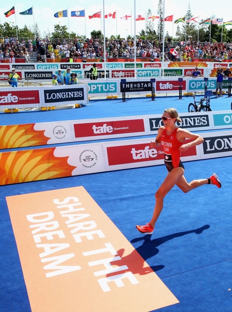 Canada's Joanna Brown races to the line to win bronze in the women's triathlon on Day One of the Gold Coast 2018 Commonwealth Games. 