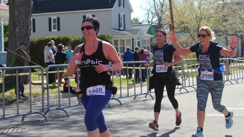 Three people running in a race.