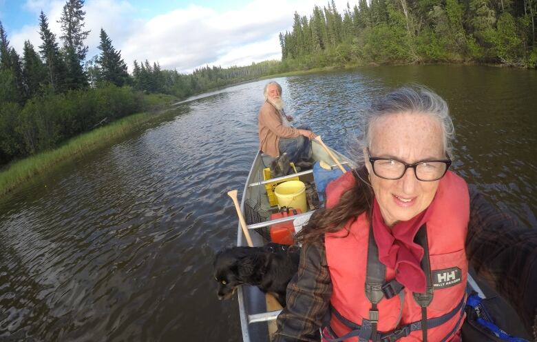 Two people in a canoe. 