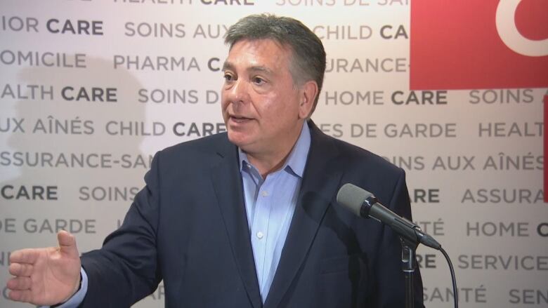 Liberal Mississauga-South MPP Charles Sousa speaks to reporters about the 