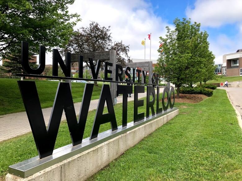 A sign outside a university in Ontario reads University of Waterloo.