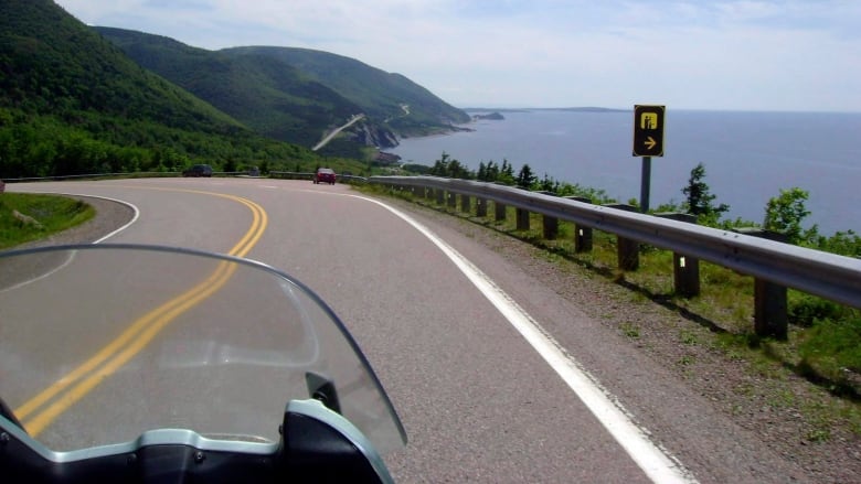 A stretch of highway is seen alongside a breathtaking vista on the Cabot Trail.