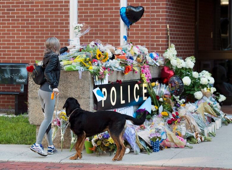 Flowers on the sign outside the Fredericton police station