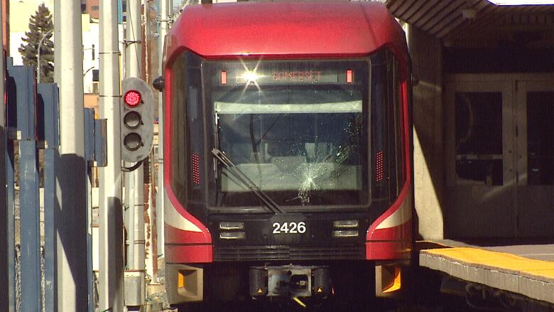 a front view of an LRT car at a station in Calgary.