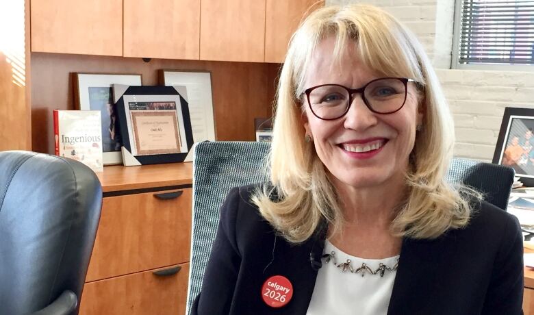 A woman is pictured in an office.